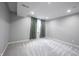 Basement room with neutral walls, carpet, and a window allowing natural light, a versatile space at 15694 Provincial Ln, Fishers, IN 46040