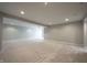 A large basement area with neutral walls and carpeting, ideal for a variety of living arrangements at 15694 Provincial Ln, Fishers, IN 46040