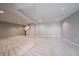Expansive basement area with neutral carpeting, modern lighting, and ample space for storage or activities at 15694 Provincial Ln, Fishers, IN 46040