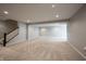 Spacious unfinished basement with modern lighting, neutral carpeting, and staircase access at 15694 Provincial Ln, Fishers, IN 46040