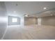 Expansive basement area with neutral carpeting, recessed lighting, and potential for customization at 15694 Provincial Ln, Fishers, IN 46040