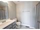Bathroom with a vanity, toilet, shower with neutral colors, and modern fixtures at 15694 Provincial Ln, Fishers, IN 46040