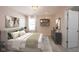 Well-lit bedroom with decor, shelving, TV, and a king bed creates a cozy and relaxing atmosphere at 15694 Provincial Ln, Fishers, IN 46040