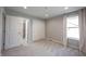 Bedroom featuring neutral walls, soft carpeting, a window, and a closet for ample storage at 15694 Provincial Ln, Fishers, IN 46040