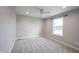 Bedroom featuring soft carpeting, a bright window, a ceiling fan, and neutral walls at 15694 Provincial Ln, Fishers, IN 46040