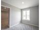 Bedroom with neutral carpeting, a window, and a door leading to another room at 15694 Provincial Ln, Fishers, IN 46040