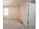 Bedroom with neutral walls, plush carpeting, natural lighting, and a peek into the en-suite bathroom at 15694 Provincial Ln, Fishers, IN 46040