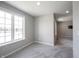 Bright bedroom featuring plush carpeting, a large window, and neutral paint, creating a welcoming atmosphere at 15694 Provincial Ln, Fishers, IN 46040