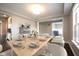 Well-appointed dining room features stylish decor and a clear view into the living space at 15694 Provincial Ln, Fishers, IN 46040
