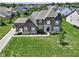 Beautiful brick two-story home featuring a well-manicured lawn and attached two car garage at 15694 Provincial Ln, Fishers, IN 46040