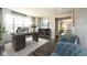 Inviting home office with dark wood floors, a large window, and comfortable seating area at 15694 Provincial Ln, Fishers, IN 46040