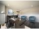 Bright home office features a modern desk, stylish decor, and comfortable seating area at 15694 Provincial Ln, Fishers, IN 46040
