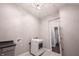 Bright laundry room featuring a modern washer, dryer, and neutral color scheme with stylish light fixture at 15694 Provincial Ln, Fishers, IN 46040