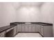 The laundry room features a large countertop, sink, and plenty of cabinet space at 15694 Provincial Ln, Fishers, IN 46040