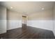 Bright living room with wood floors and white wainscoting at 15694 Provincial Ln, Fishers, IN 46040