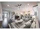 Open-concept living room flowing into the kitchen, featuring stylish decor and ample seating at 15694 Provincial Ln, Fishers, IN 46040
