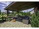 Stunning outdoor patio with a cozy fire pit, comfortable seating, and meticulously maintained landscaping at 15694 Provincial Ln, Fishers, IN 46040