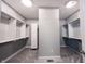 Spacious walk-in closet with custom shelving, carpet, and lighting at 15694 Provincial Ln, Fishers, IN 46040
