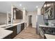 Modern kitchen with stainless steel appliances, dark cabinetry, and light countertops at 1692 S Centennial Ave, New Palestine, IN 46163