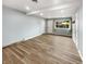 Finished basement features light blue walls, two doors, one window, and wood-look flooring at 17 Crestview Dr, Greenwood, IN 46143