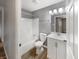 Bathroom featuring a shower and tub combo, white vanity with sink, and a modern light fixture at 17 Crestview Dr, Greenwood, IN 46143