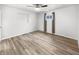 Bright bedroom featuring new hard wood flooring, neutral paint, and natural light at 17 Crestview Dr, Greenwood, IN 46143