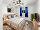 Cozy bedroom with a comfortable bed, soft blue accents, and a bright window view at 17 Crestview Dr, Greenwood, IN 46143