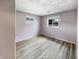 Bedroom featuring wood-look flooring, neutral paint, and a double window at 17 Crestview Dr, Greenwood, IN 46143