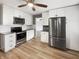 Updated kitchen featuring stainless steel appliances, granite countertops, and white cabinetry at 17 Crestview Dr, Greenwood, IN 46143