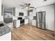 Modern kitchen with white cabinets, stainless steel appliances, and granite countertops at 17 Crestview Dr, Greenwood, IN 46143