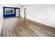 Spacious living room featuring light wood floors, a ceiling fan, and ample natural light at 17 Crestview Dr, Greenwood, IN 46143
