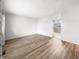 A spacious living room with wood-look floors and large opening into an adjacent room at 17 Crestview Dr, Greenwood, IN 46143