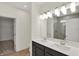 Bathroom featuring double sinks, a walk-in shower, and vanity with ample lighting at 19714 Highclere Ln, Sheridan, IN 46069