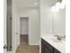 Bathroom with a walk-in shower, dark brown cabinets, and a bright vanity at 19714 Highclere Ln, Sheridan, IN 46069