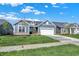 Inviting single-Gathering home with a two-car garage, complemented by a lush green lawn and clear blue skies at 19714 Highclere Ln, Sheridan, IN 46069
