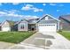 Attractive single-Gathering home with a two-car garage, lush lawn, and concrete driveway, perfect for suburban living at 19714 Highclere Ln, Sheridan, IN 46069
