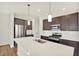 Modern kitchen with stainless steel appliances and central island at 19714 Highclere Ln, Sheridan, IN 46069