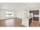 Open concept kitchen with stainless appliances, island and modern finishes at 19714 Highclere Ln, Sheridan, IN 46069