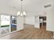 Open concept living area with hardwood floors, chandelier and recessed lights at 19714 Highclere Ln, Sheridan, IN 46069