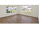 Bright living room with large windows overlooking the backyard at 19714 Highclere Ln, Sheridan, IN 46069