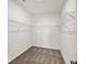 Walk-in closet with white shelving and neutral carpeting at 19714 Highclere Ln, Sheridan, IN 46069