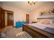 Bedroom featuring a wooden bed frame, accent decor, and ample natural light for relaxation and comfort at 198 E Madison St, Franklin, IN 46131