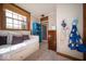 Bright bedroom featuring a daybed with storage, built-in shelves, and a large window with natural light at 198 E Madison St, Franklin, IN 46131