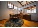 Dining room with hardwood floors, large windows, and seating for four at 198 E Madison St, Franklin, IN 46131