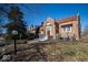 Inviting brick home showcasing a well-maintained lawn, classic architecture, red roof, and welcoming front porch at 198 E Madison St, Franklin, IN 46131