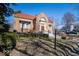 Charming brick home with a well-kept lawn, red roof, attractive front entry, and mature landscaping at 198 E Madison St, Franklin, IN 46131
