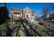 Attractive brick home featuring a well-manicured lawn, red roof, and welcoming entrance with marble stairs at 198 E Madison St, Franklin, IN 46131