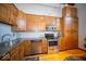 Kitchen boasts stainless steel appliances, granite counters and hardwood floors at 198 E Madison St, Franklin, IN 46131