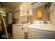 Laundry room featuring washer, dryer, and storage shelves at 198 E Madison St, Franklin, IN 46131