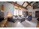 Bright and airy living room with a large grey sectional, vaulted ceilings, and lots of natural light at 198 E Madison St, Franklin, IN 46131